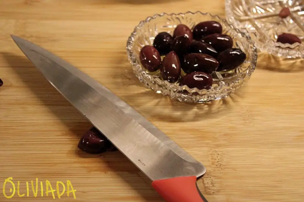 pit olives at home with knife