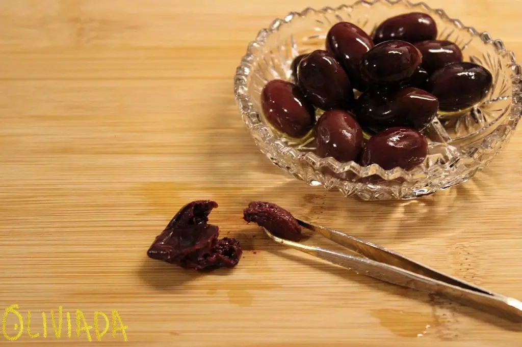 pit olives at home with tweezer
